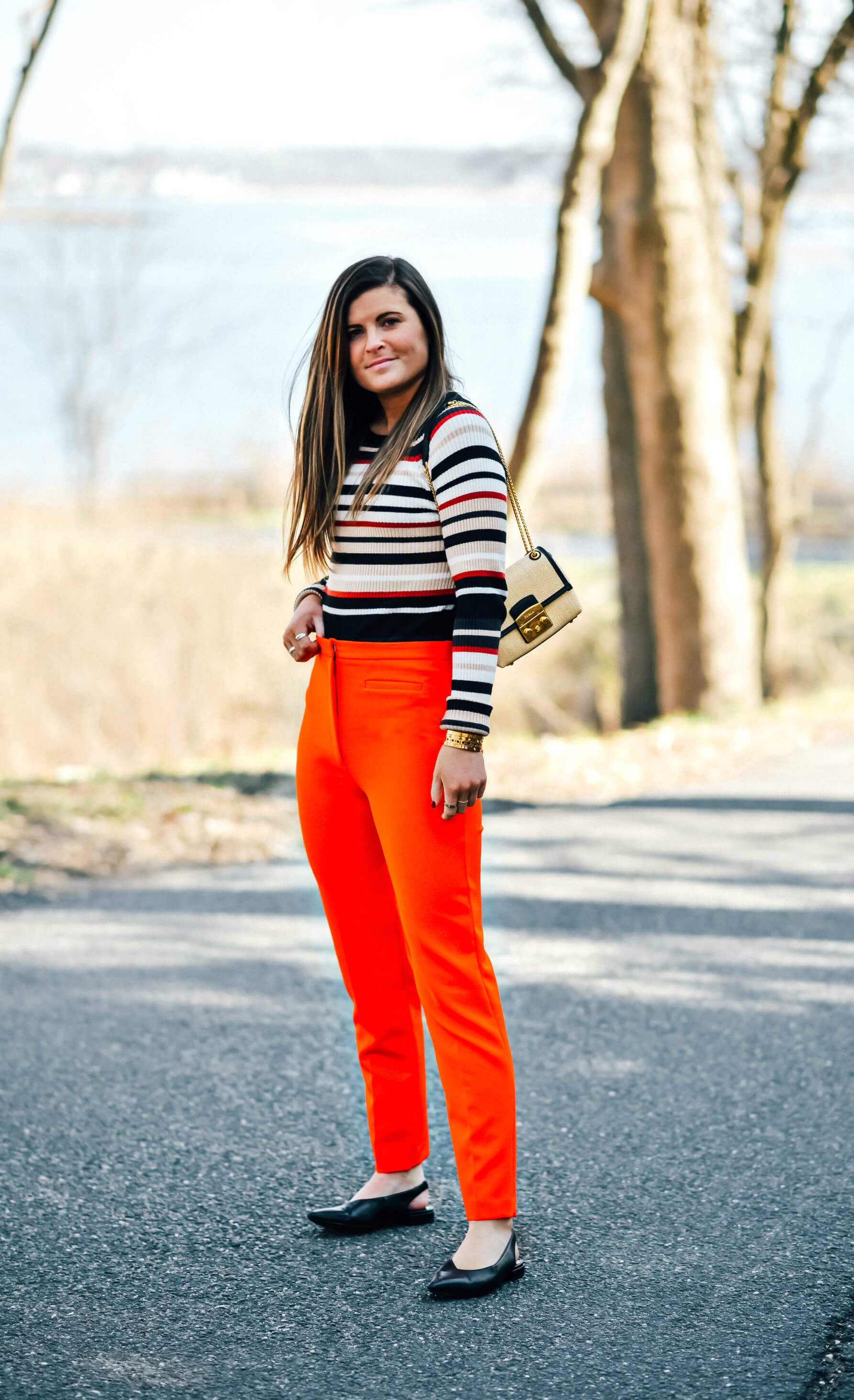 Milly Skinny High Waisted Red Pant, Striped Knit Sweater Top, Furla Metropolis Basket Weave Straw Crossbody Bag, Sam Edelman Black Slingback Flats, Business Casual Outfit, Spring Business Casual Outfit, Pop of Color Work Outfit, Tilden of To Be Bright