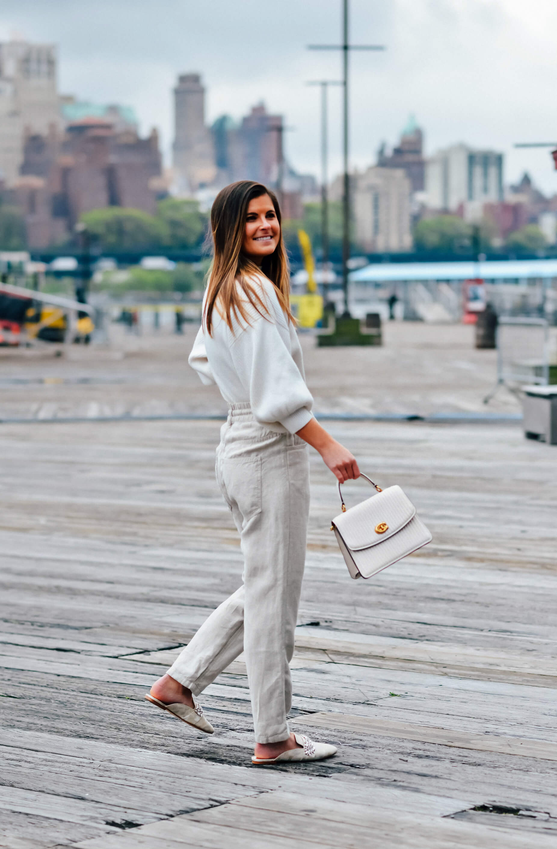 Linen pants outfit, White pullover sweater, Coach White Parker Quilted Top Handle Bag, Badgley Mischka Ebellished Mules, Easy Summer Outfit Idea, Tilden of To Be Bright