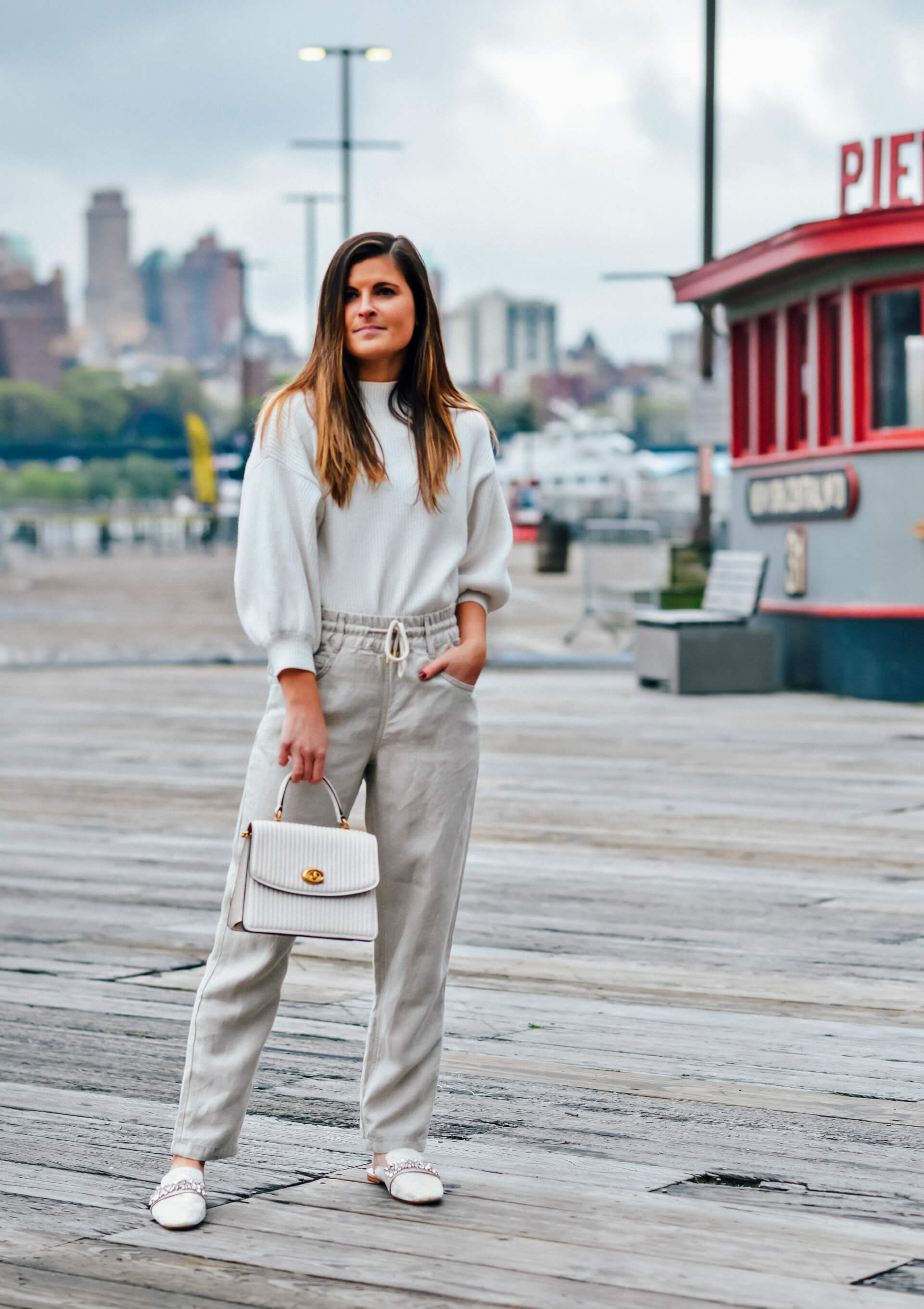 Linen pants outfit, White pullover sweater, Coach White Parker Quilted Top Handle Bag, Badgley Mischka Ebellished Mules, Easy Summer Outfit Idea, Tilden of To Be Bright