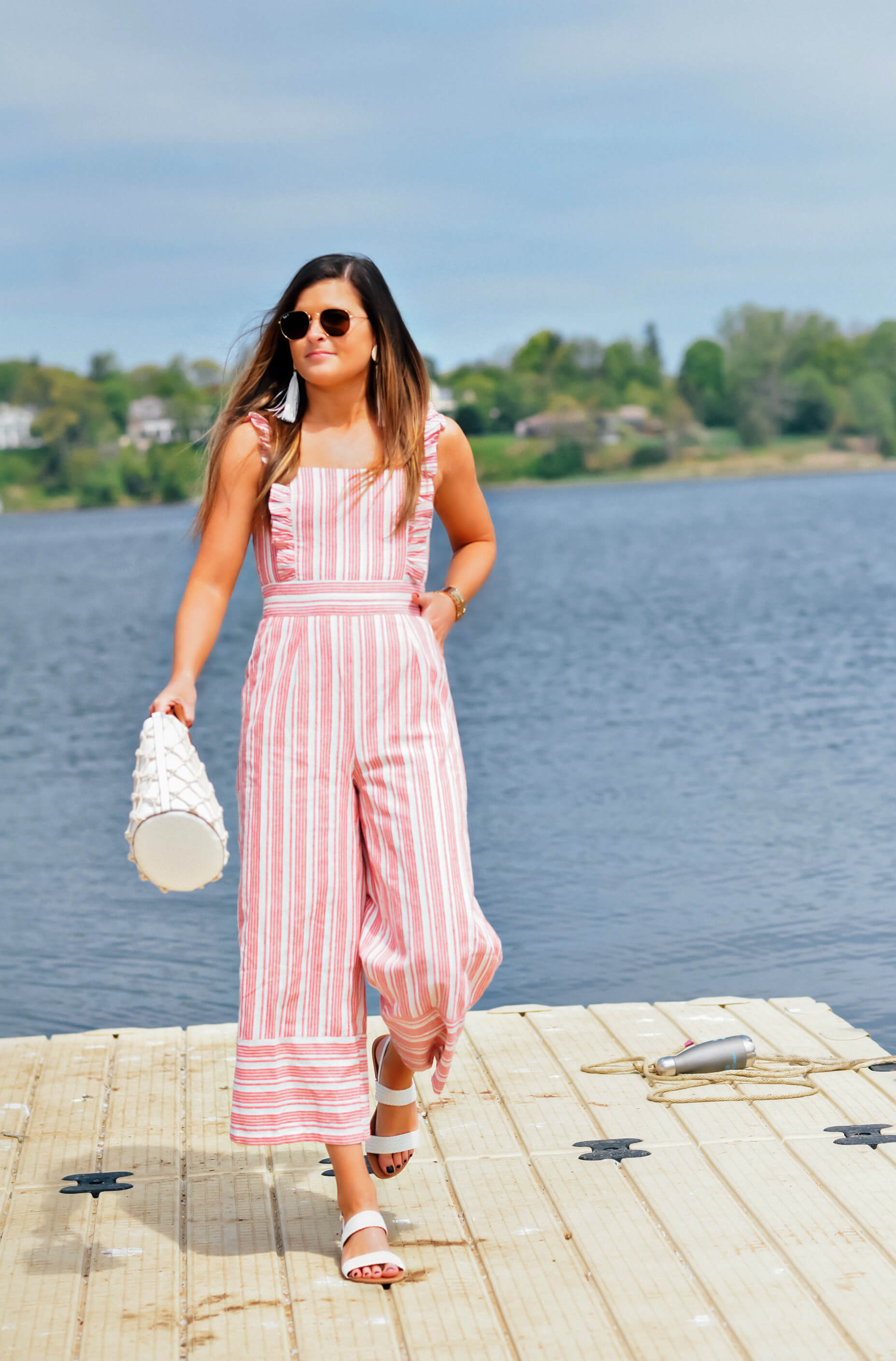 LULUS EMILIA RAE WHITE AND RED STRIPED RUFFLE CULOTTE JUMPSUIT, LULUS BLAISE WHITE FLAT SANDALS, LULUS MELLOW MOOD WHITE NET TOTE, LULUS STAY RAD WHITE WOVEN RATTAN TASSEL EARRINGS, Memorial Day Outfit Idea, Memorial Day Style, Tilden of To Be Bright